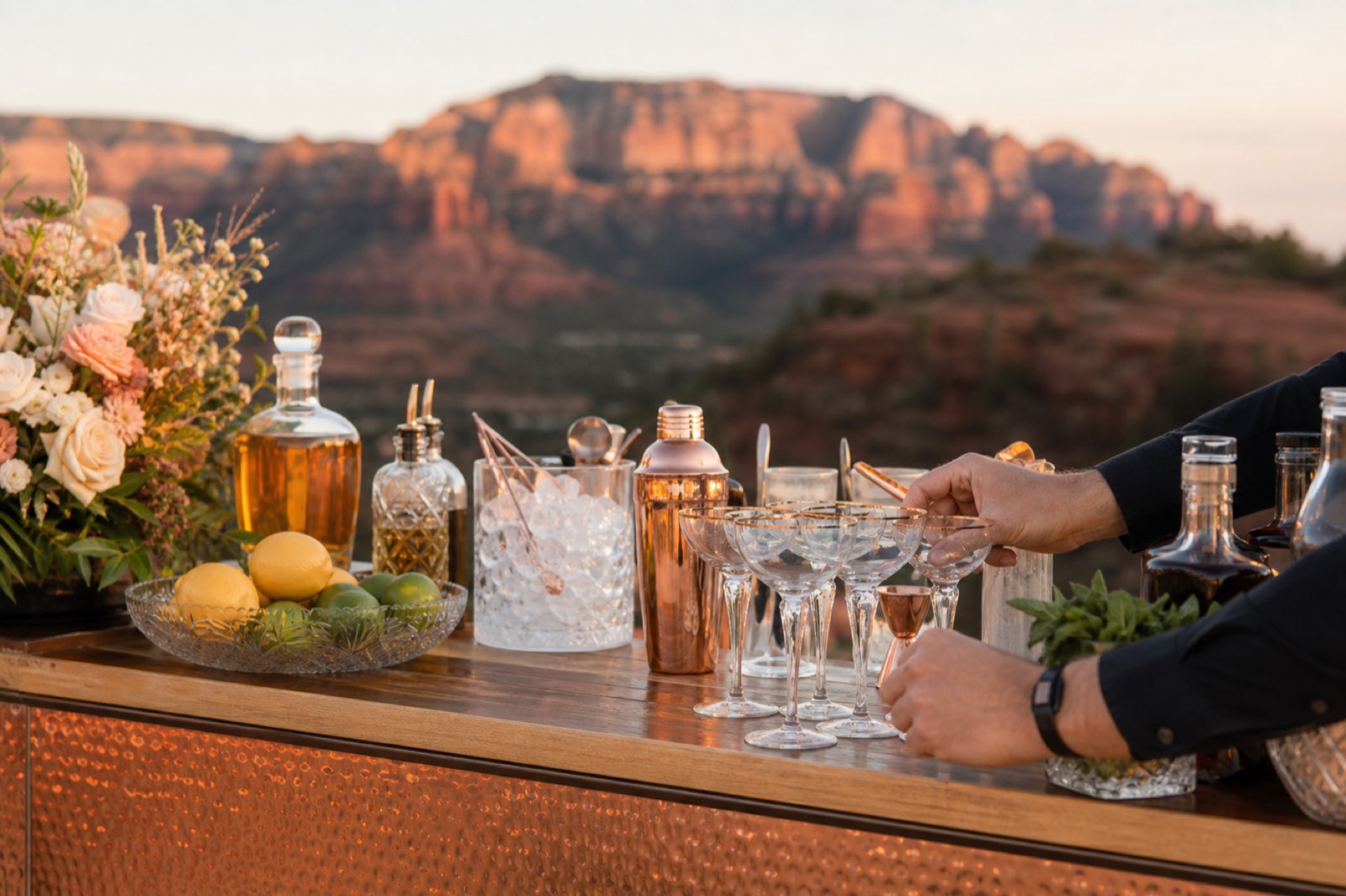 Outdoor Sedona wedding bar with glassware and copper details