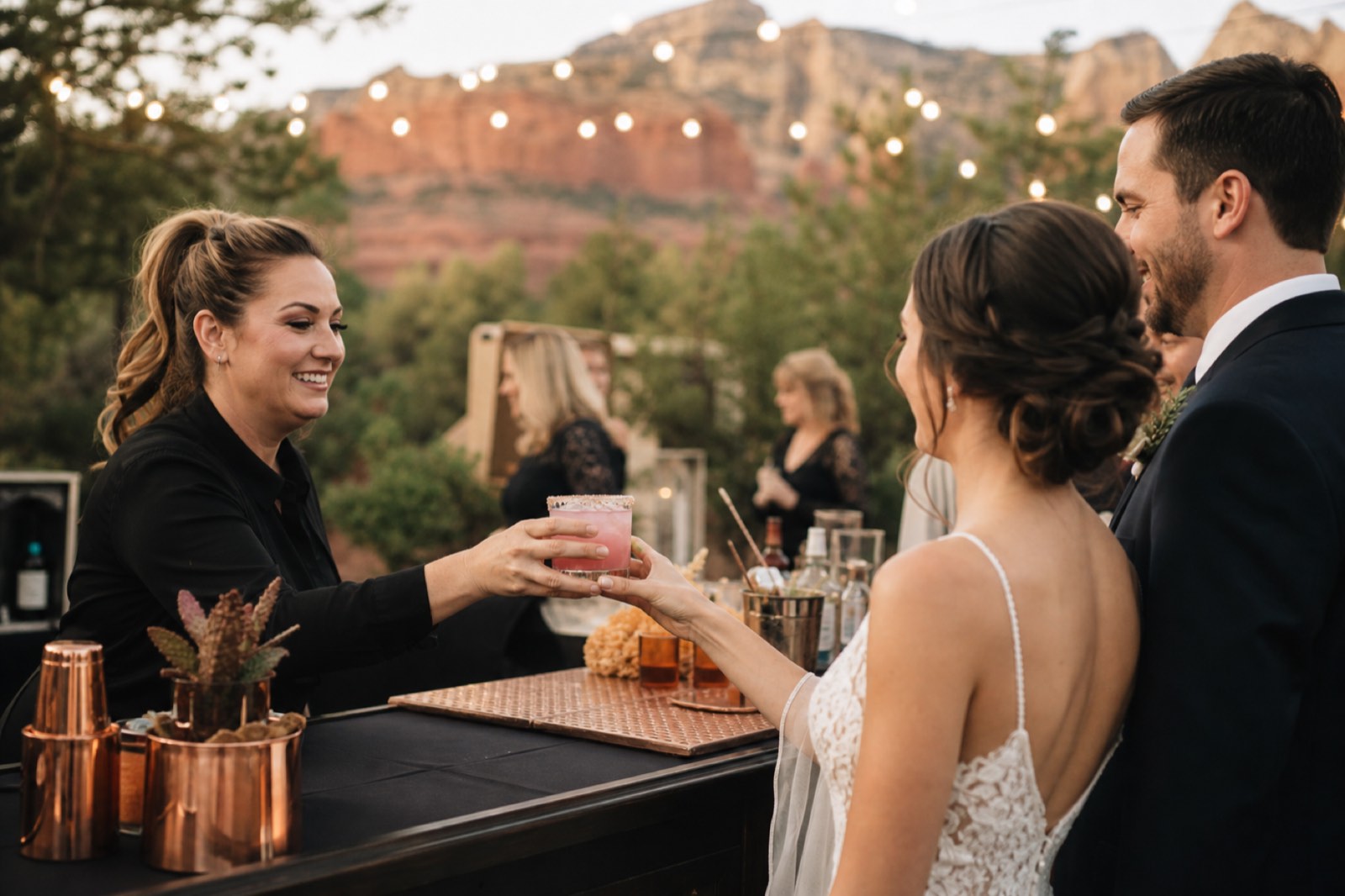 Bartender serving a cocktail at a Sedona wedding reception